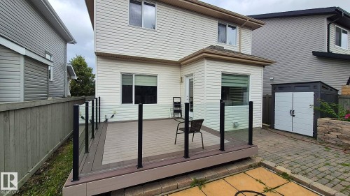 Landscaped backyard with deck at 131 57 Street SW Edmonton